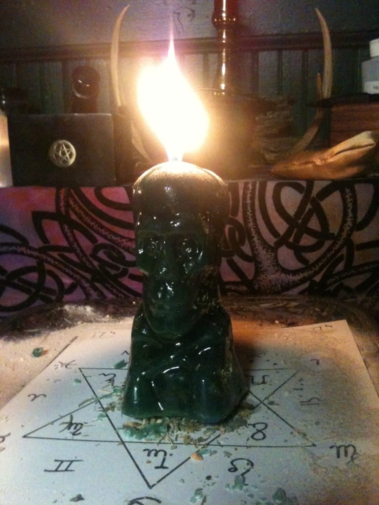 Skull candles, financial wisdom spell at Conjure Work